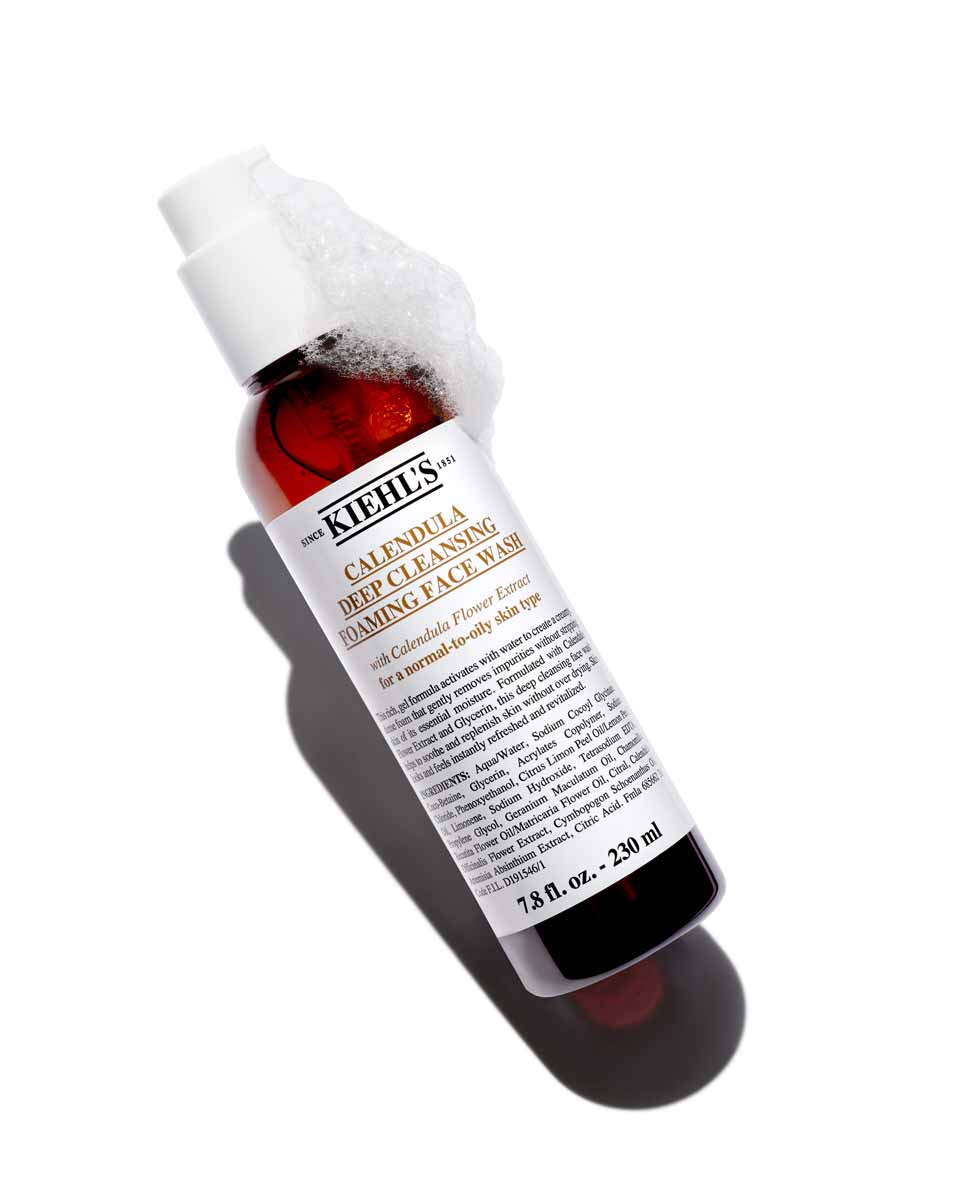 230 ml bottle of Kiehl's Calendula Deep Cleansing Foaming Face Wash with foam on pump.